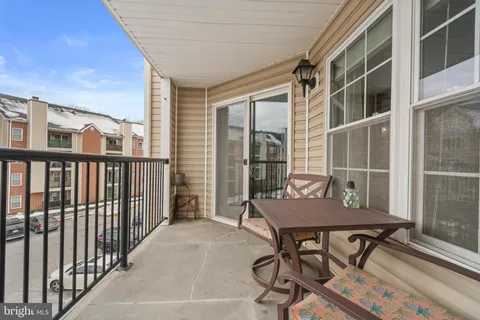 a view of a balcony with furniture