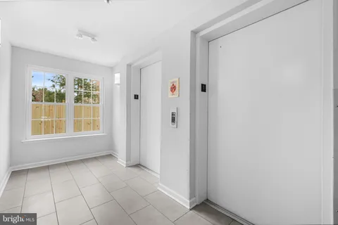 a view of an empty room with windows