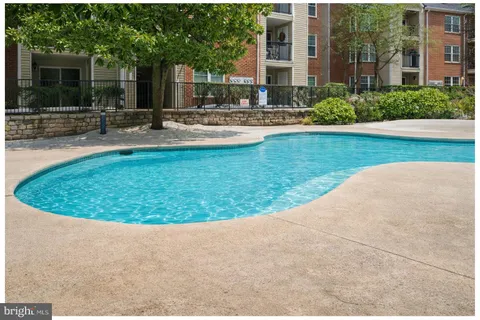 a view of a house with backyard porch and sitting area