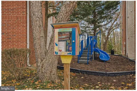 a view of a park with iron fence