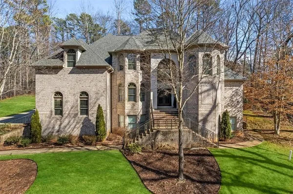 a front view of a house with a yard