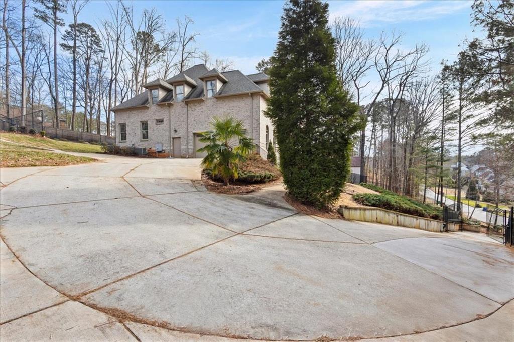 1859 Mountain Shadow Smoke Rise, GA 30087 - Photo 11 of 75 a view of a building with trees