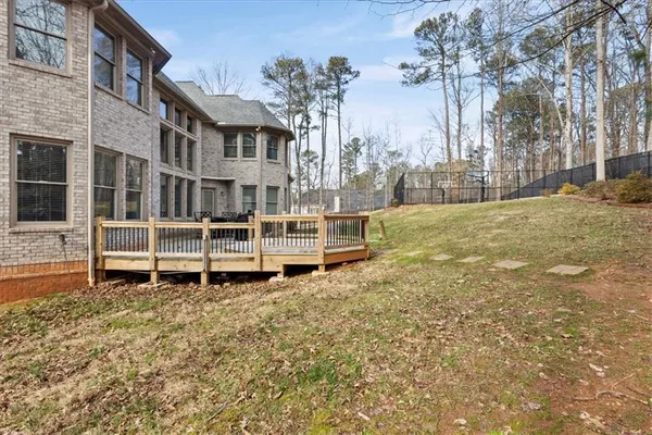 a living room with furniture a fireplace and a chandelier