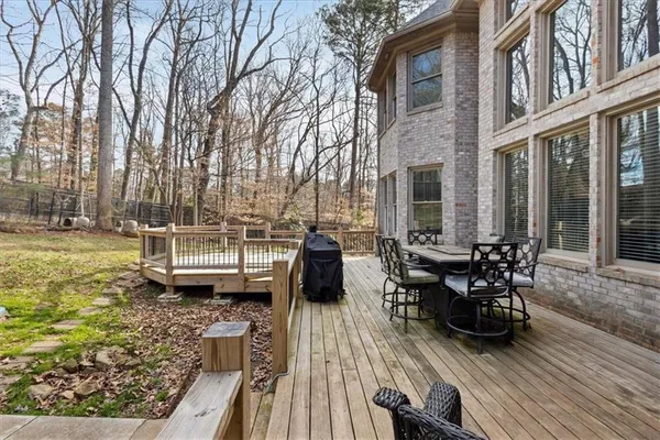 a view of a porch with furniture and garden