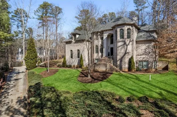 a front view of a house with a yard