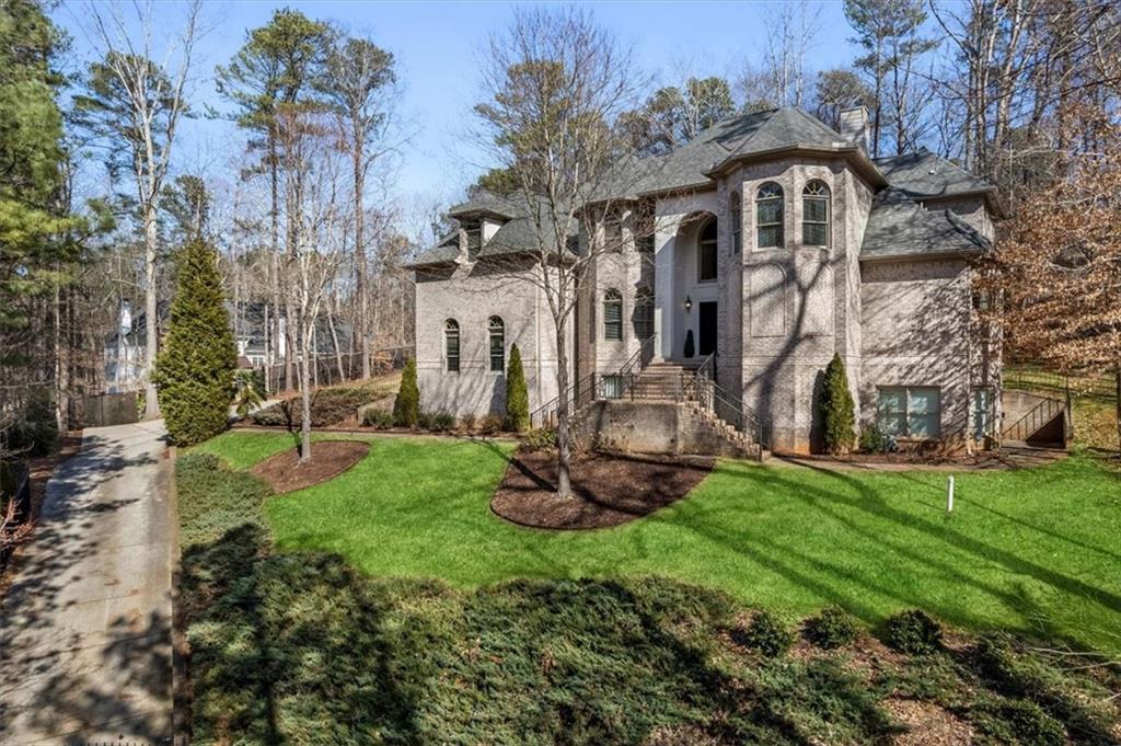 1859 Mountain Shadow Smoke Rise, GA 30087 - Photo 2 of 75 a front view of a house with a yard