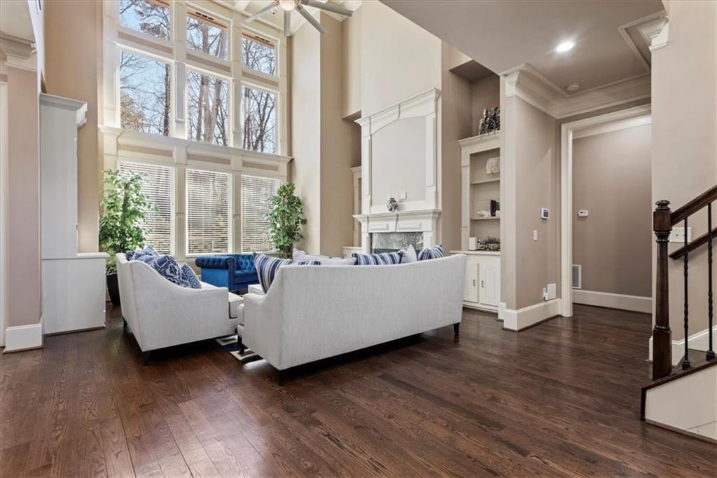 1859 Mountain Shadow Smoke Rise, GA 30087 - Photo 23 of 75 a living room with furniture wooden floor and a large window