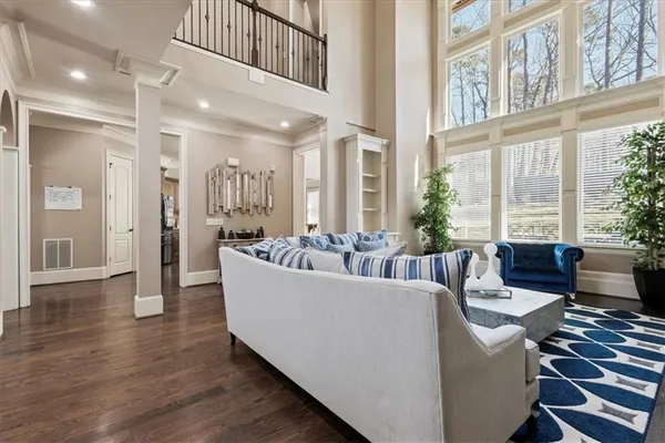 a spacious bedroom with a bed and a couch