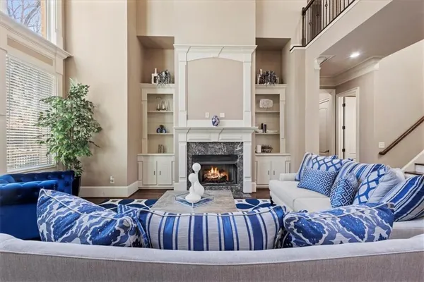 a bedroom with a bed and a ceiling fan