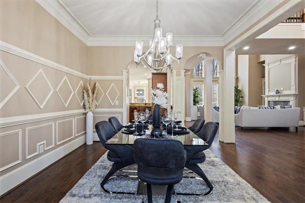 1859 Mountain Shadow Smoke Rise, GA 30087 - Photo 30 of 75 a living room with furniture chandelier and a wooden floor