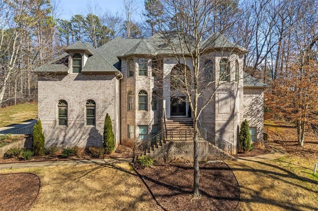 1859 Mountain Shadow Smoke Rise, GA 30087 - Photo 3 of 75 a front view of a house with large windows