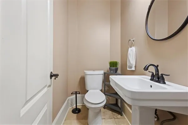 a spacious bedroom with a bed and a ceiling fan