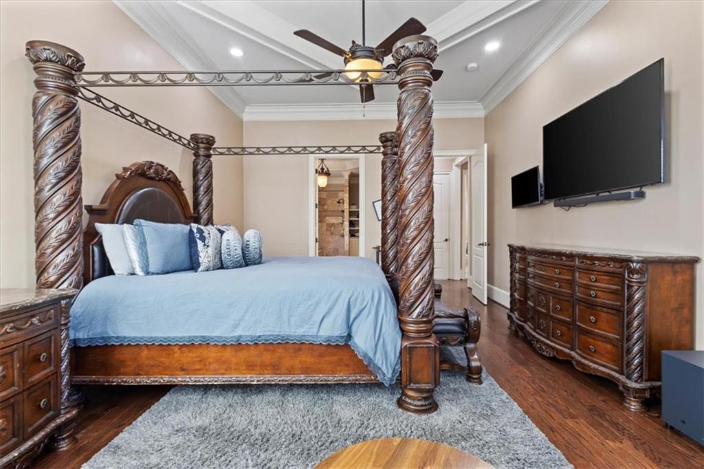 1859 Mountain Shadow Smoke Rise, GA 30087 - Photo 34 of 75 a bedroom with a bed and a flat screen tv