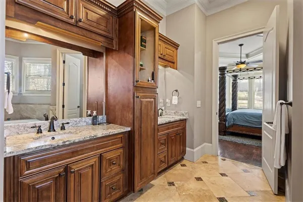 a kitchen with stainless steel appliances granite countertop a stove refrigerator and cabinets