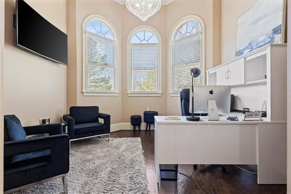 a view of a dining room with furniture and wooden floor
