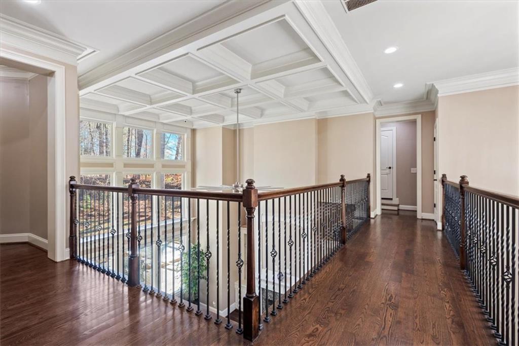 1859 Mountain Shadow Smoke Rise, GA 30087 - Photo 40 of 75 a view of a hallway with wooden floor and windows
