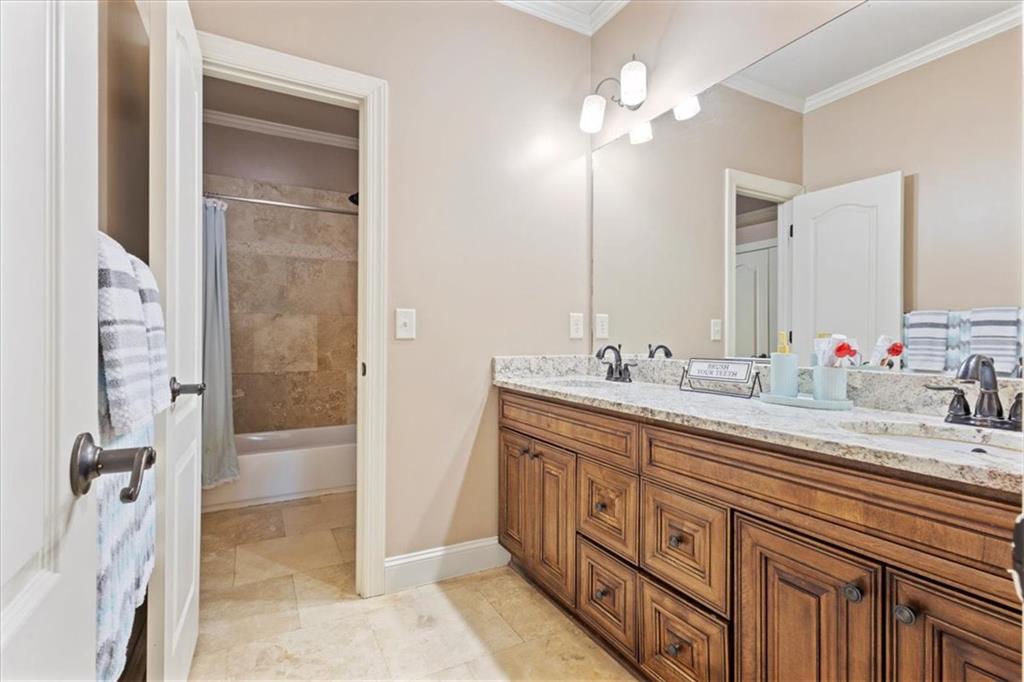 1859 Mountain Shadow Smoke Rise, GA 30087 - Photo 46 of 75 a bathroom with double vanity sinks a vanity two mirror and a shower