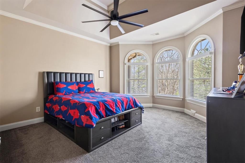 1859 Mountain Shadow Smoke Rise, GA 30087 - Photo 50 of 75 a bed sitting in a bedroom next to a window