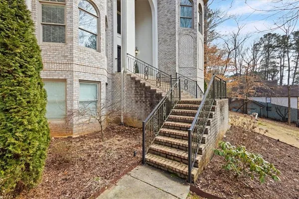 a front view of a house with garden