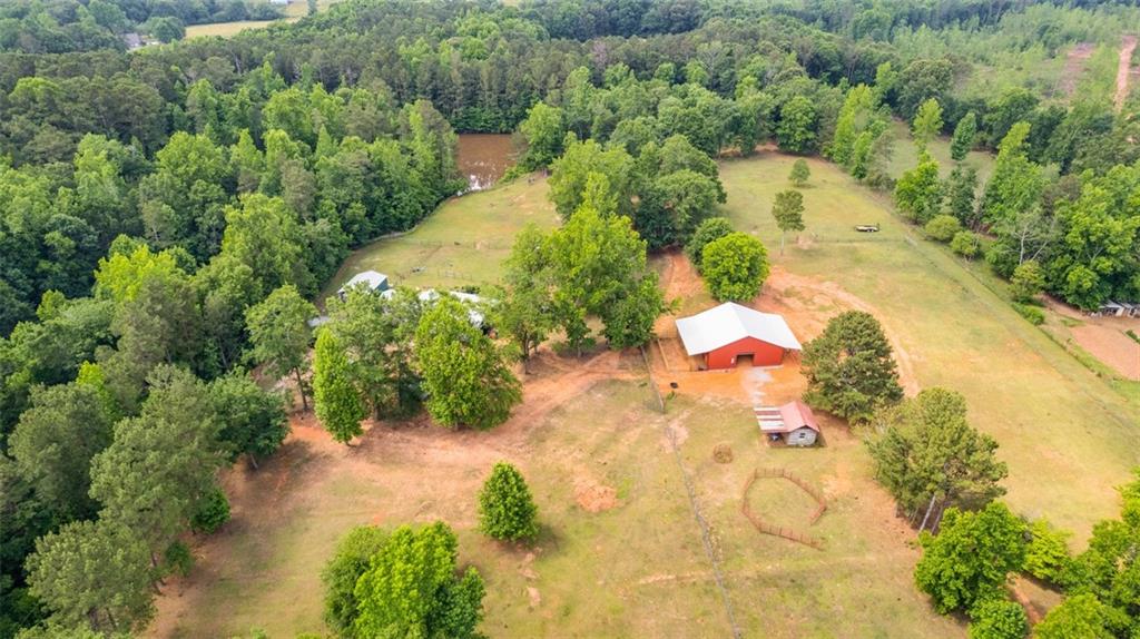 247 Simms Road Carrollton, GA 30117 - Photo 1 of 1 an aerial view of a house with swimming pool and lawn chairs