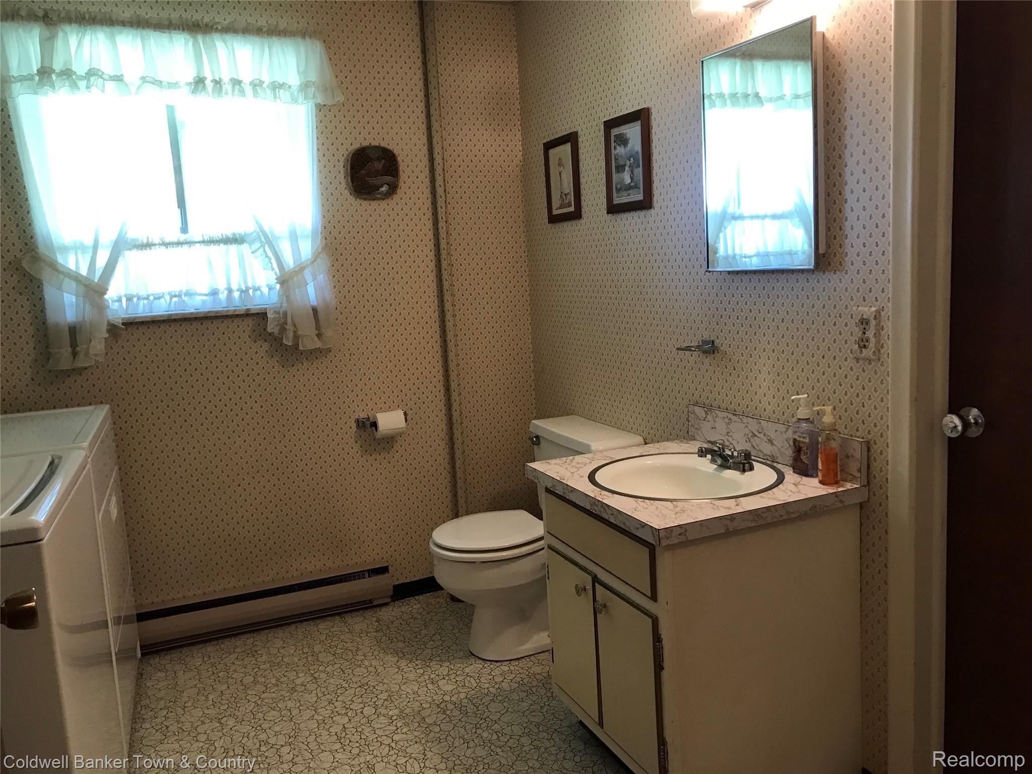 2442 Fisher Road Howell, MI 48855 - Photo 12 of 25 Walkout level Bath and Laundry