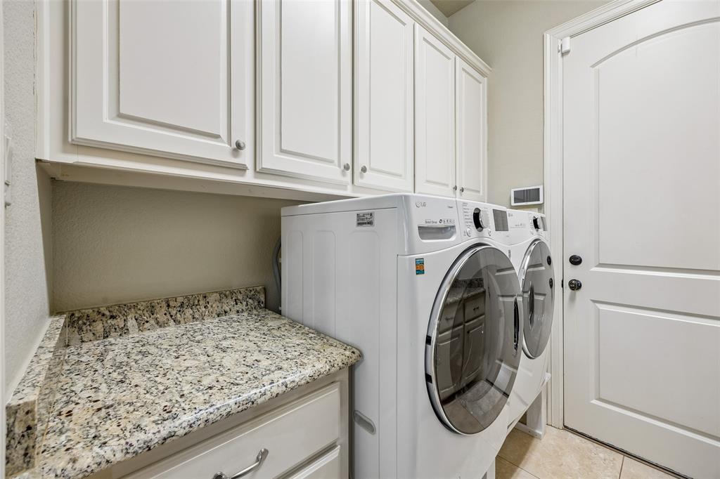 1608 Tuscan Ridge Circle Southlake, TX 76092 - Photo 28 of 36 a utility room with dryer and washer