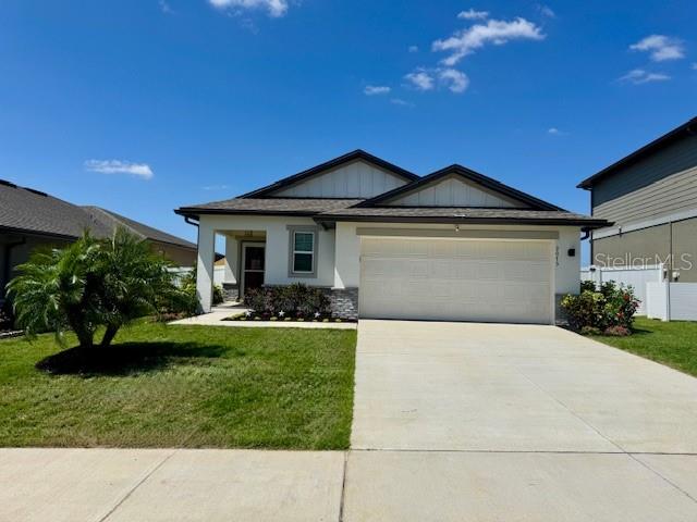 2075 Huntsman Rdg Road Clermont, FL 34715 - Photo 2 of 17 a front view of a house with a yard