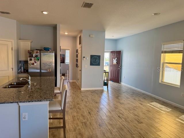 2075 Huntsman Rdg Road Clermont, FL 34715 - Photo 3 of 17 a view of a refrigerator in kitchen and living room