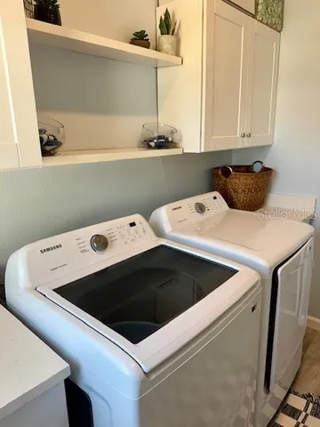 a utility room with dryer and washer