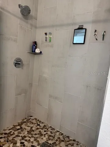 a bathroom with a sink and a shower