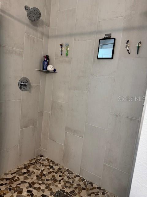 2075 Huntsman Rdg Road Clermont, FL 34715 - Photo 8 of 17 a bathroom with a sink and a shower