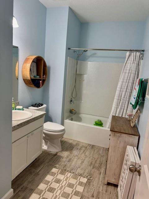 2075 Huntsman Rdg Road Clermont, FL 34715 - Photo 9 of 17 a bathroom with a granite countertop bathtub shower sink vanity and toilet