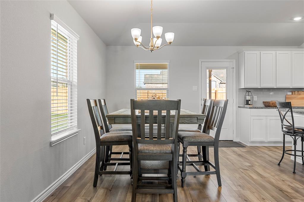 10761 Chesson Flts Drive Waco, TX 76708 - Photo 13 of 30 a view of a dining room with furniture window and wooden floor