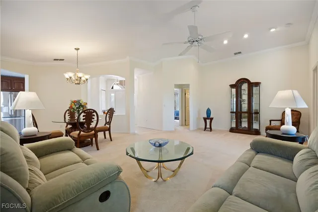 a living room with furniture and a piano