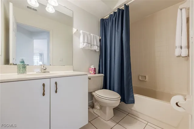 a kitchen with a sink a counter space and cabinets