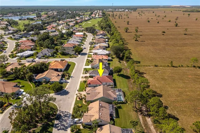 a view of a living room and chandelier with wooden floor