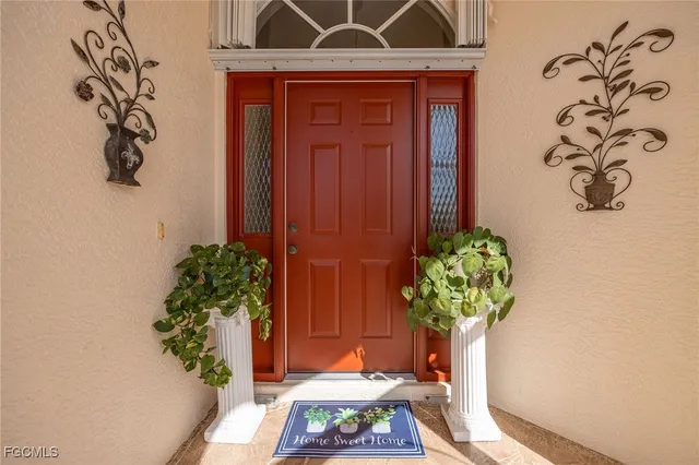 a vase of flowers sitting on a desk
