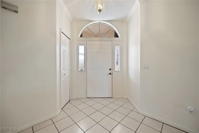 a view of a hallway to rooms