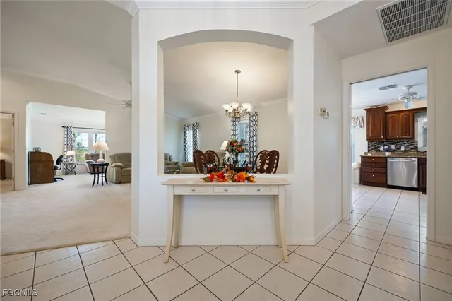 a view of a kitchen with furniture and a chandelier