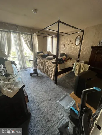 a bed room with a bed and a window