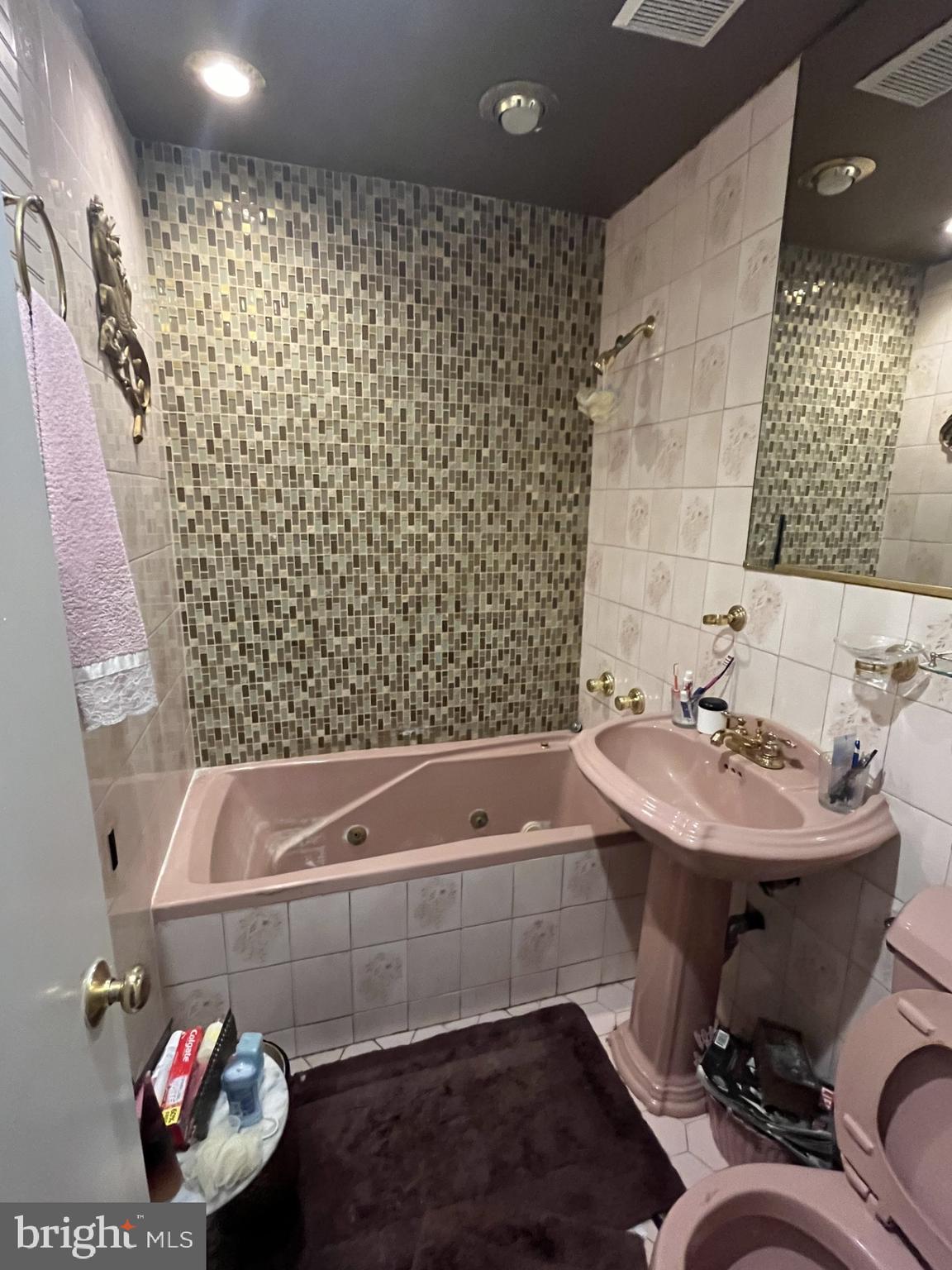 142 G Street Southwest, Unit 155 Washington, DC 20024 - Photo 3 of 13 a bathroom with a sink toilet and shower