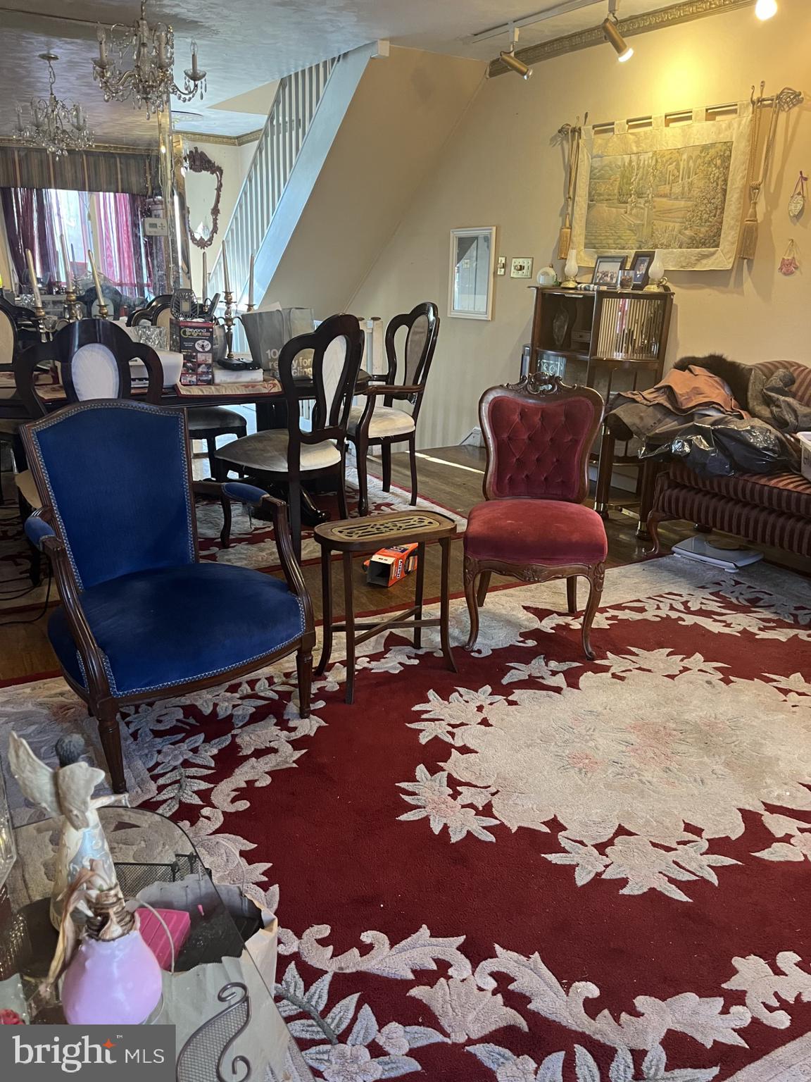 142 G Street Southwest, Unit 155 Washington, DC 20024 - Photo 6 of 13 a living room with furniture a rug and a chandelier