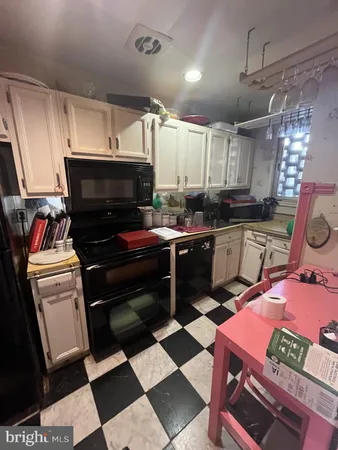 a bed sitting in a room next to a window