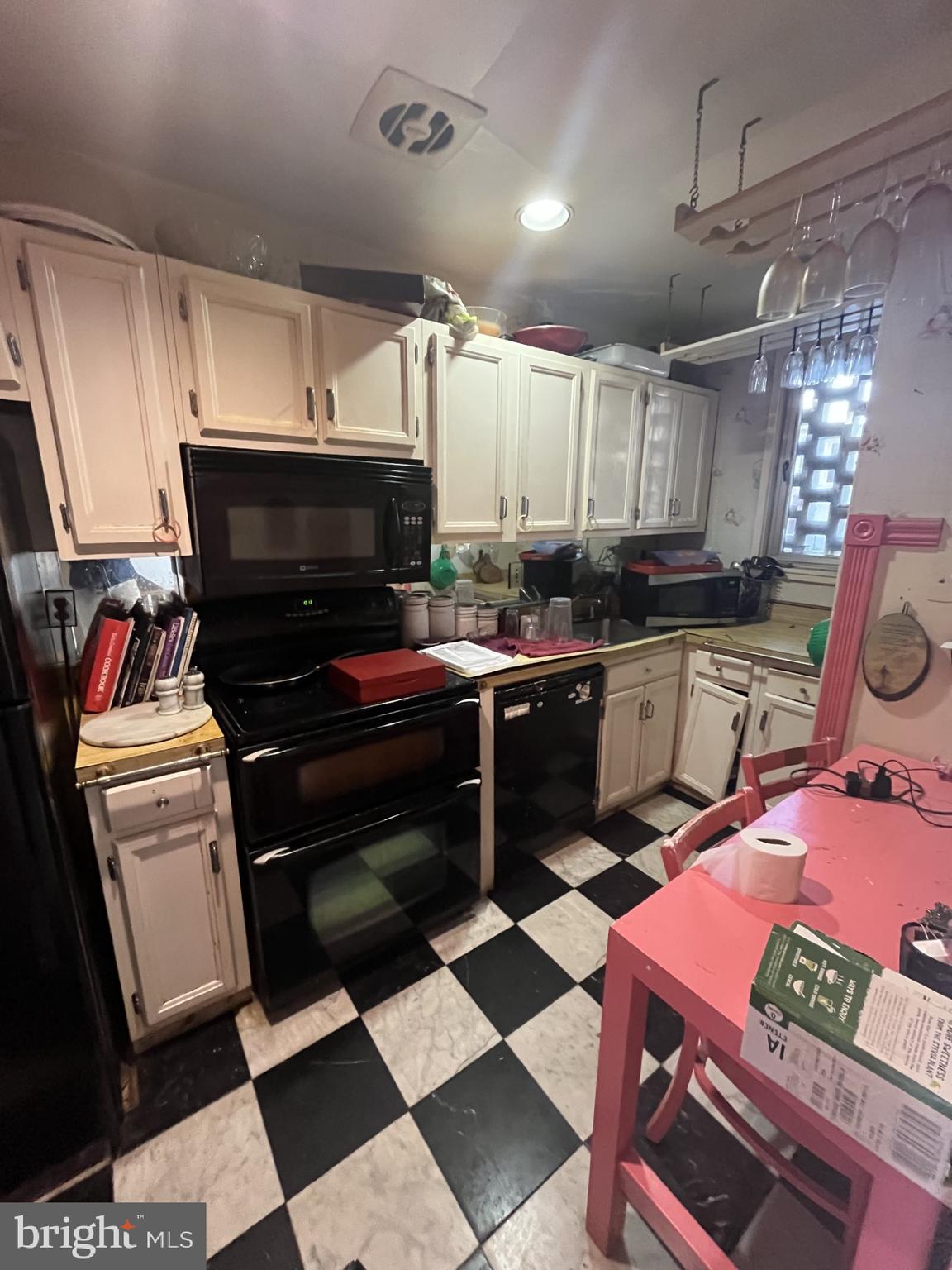 142 G Street Southwest, Unit 155 Washington, DC 20024 - Photo 9 of 13 a kitchen with a sink stove and cabinets