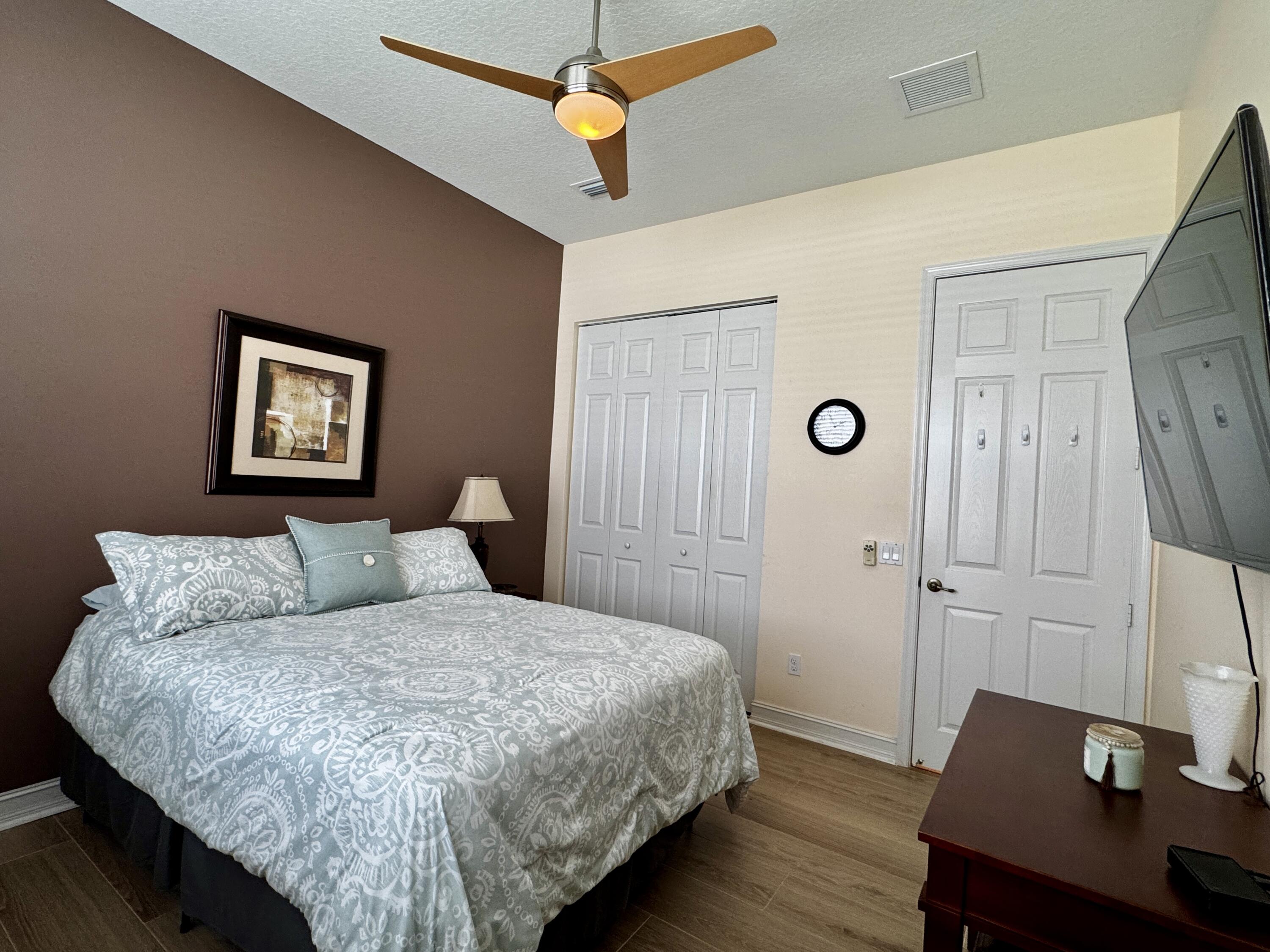 9385 Ivory Isle Road Boynton Beach, FL 33473 - Photo 11 of 50 a bedroom with a bed and a desk