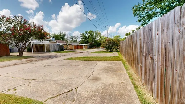 a view of a house with a yard and garage
