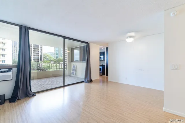 a view of an empty room with glass door