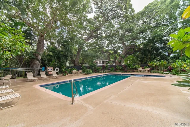 a view of a swimming pool with a patio