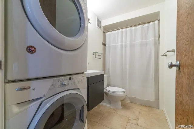 a bathroom with a toilet and a sink