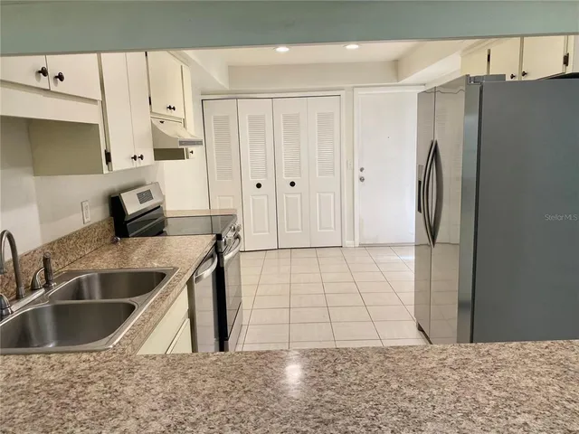a view of a kitchen with a sink